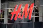 Milan, Italy - September 27, 2011: Close up of the logo for the H&amp;M store in Milan, Italy. H&amp;M is a Swedish clothing company with over 2,200 stores worldwide.