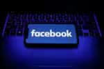 Facebook logo is seen displayed on a phone screen in this illustration photo taken in Poland on November 29, 2020. (Photo illustration by Jakub Porzycki/NurPhoto via Getty Images)